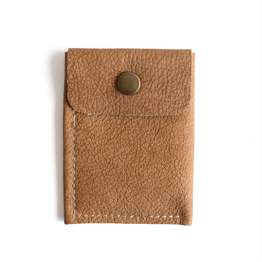 Brown leather cardholder with a button on a white background