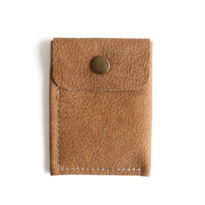 Brown leather cardholder with a button on a white background