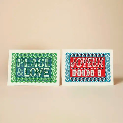Two Christmas-themed cards with 'Peace & Love' and 'Joyeux Noel' text on a beige background.