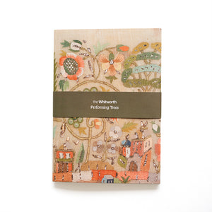 Notebook featuring an embroidered design on a white background.