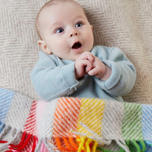 Baby in a rainbow blanket 