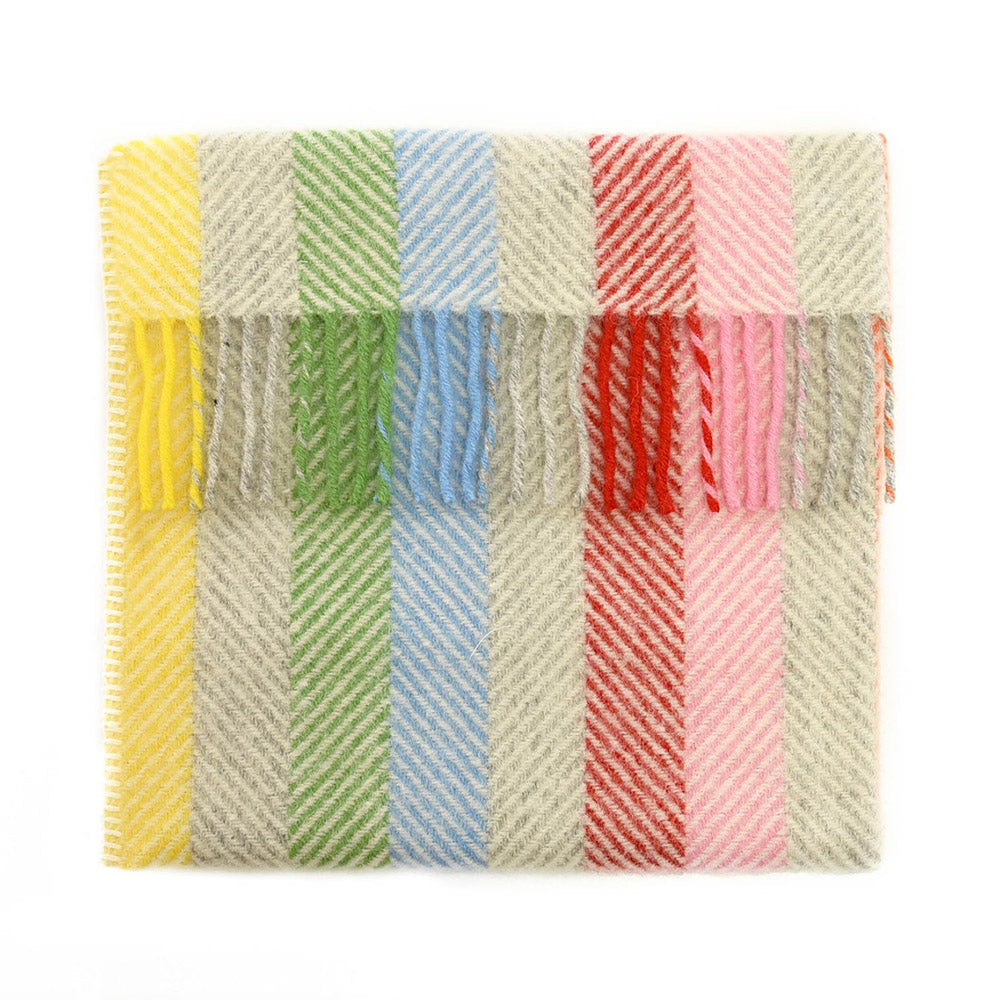 Colourful rainbow patterned fabric swatch on a white background