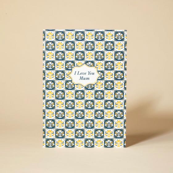 Greetings card with a yellow and navy pattern, with the words I Love You Mum at the centre