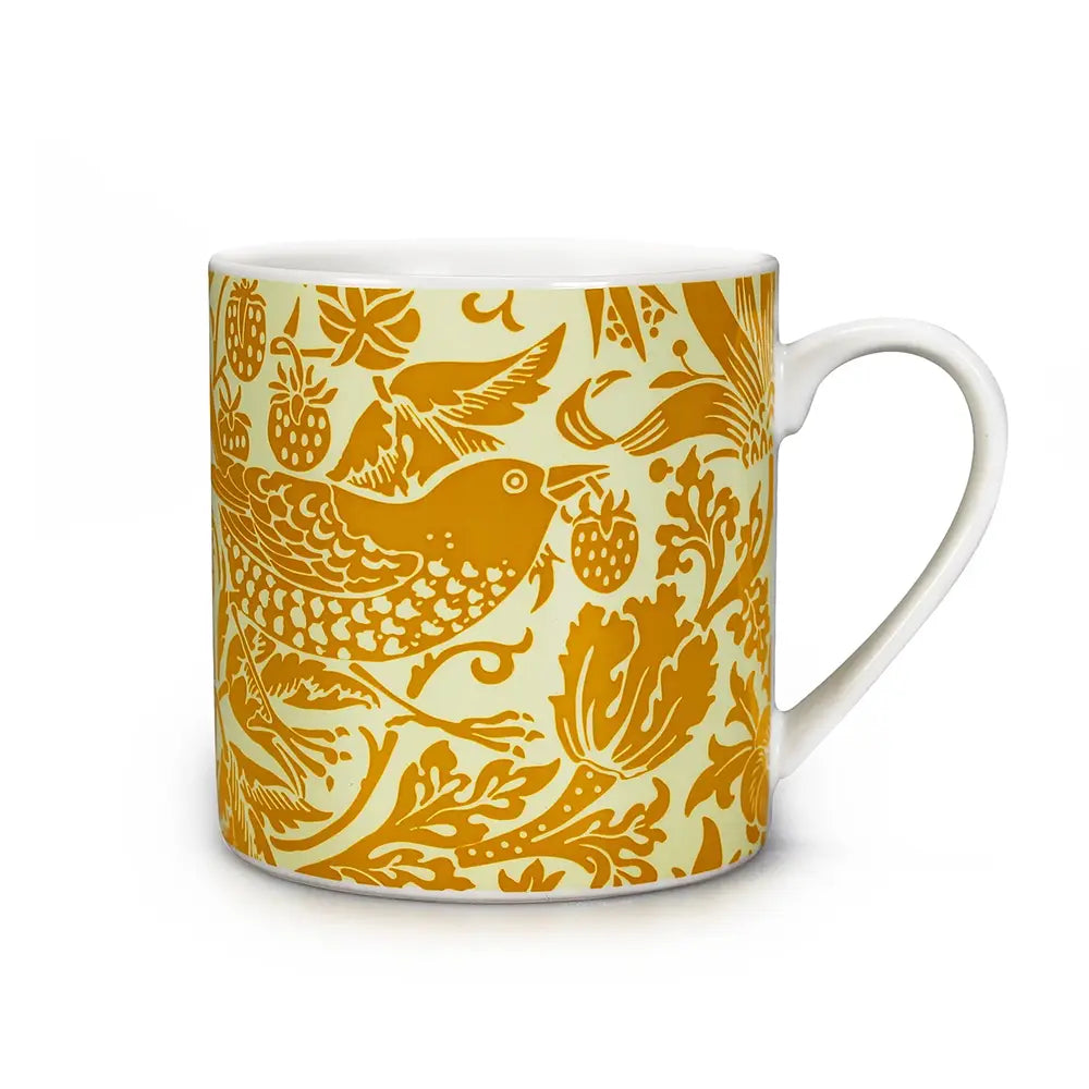Mug featuring yellow Morris 'Quince' design against a white background.