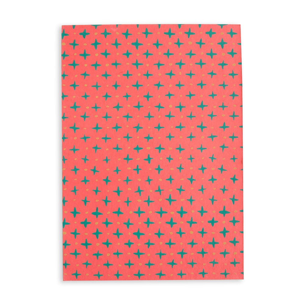 Front cover of pink scrapbook with green star pattern.