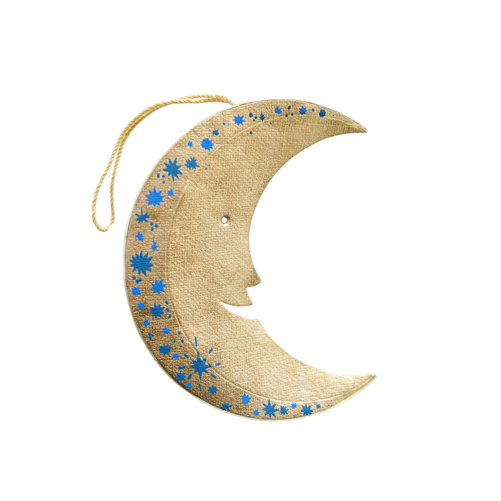 Decorative moon-shaped hanging ornament with blue star patterns on a white background