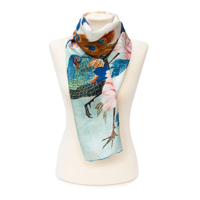 Scarf with bird design on a mannequin against a white background