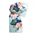Scarf with peacock and floral design on a white background