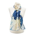 Scarf with blue and white wave design on a mannequin against a white background