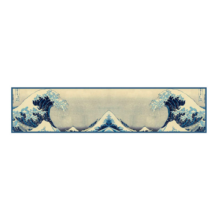 The Great Wave scarf laid flat with blue and white colours on a beige background