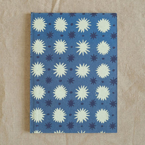 Blue sketchbook with screen-printed repeat pattern of stars
