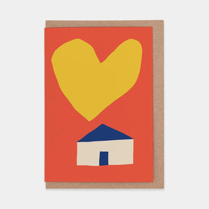 This is a card that looks like it says "Home of Love" with a big yellow heart floating over a little white house with a blue roof and door.