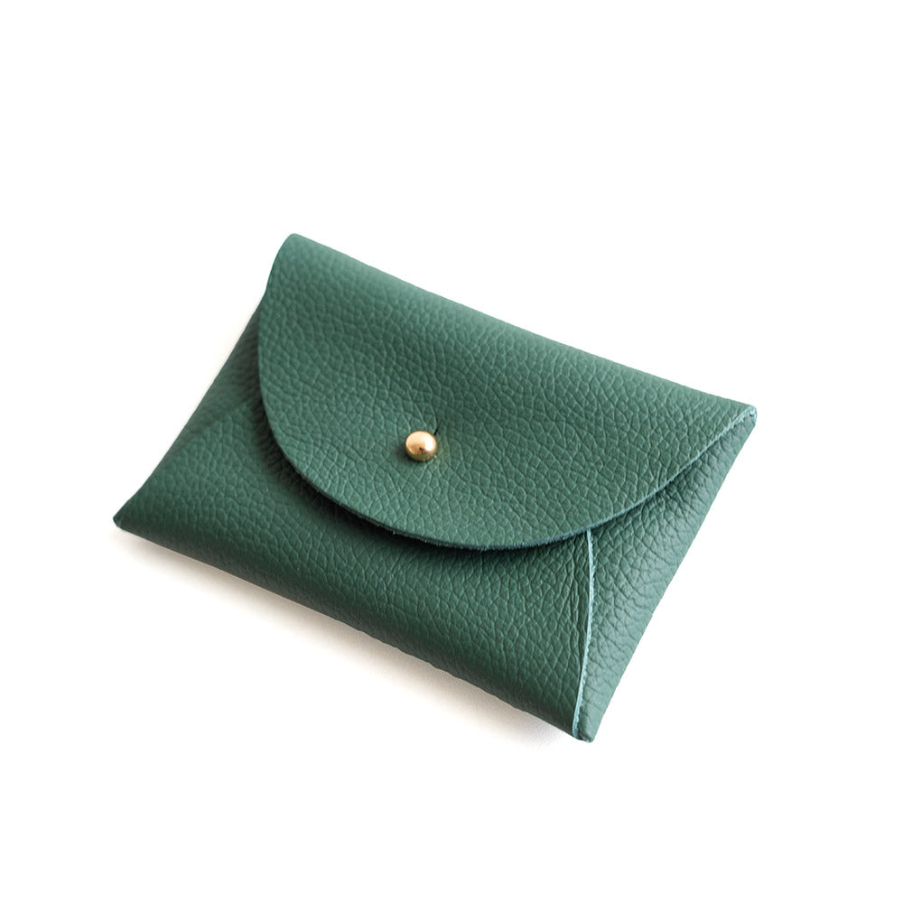 Green leather pouch with a gold button on a white background