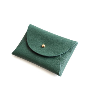 Green leather pouch with a gold button on a white background