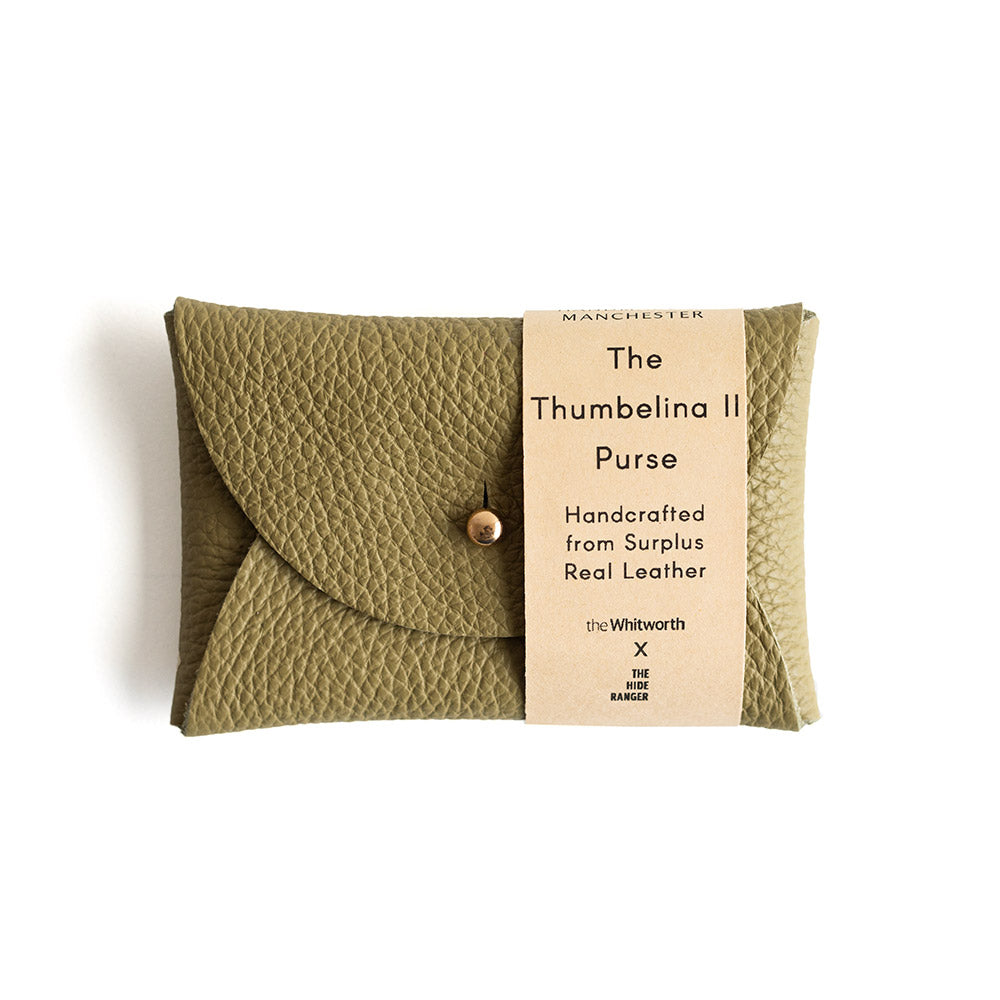 Green leather purse with a label on a white background