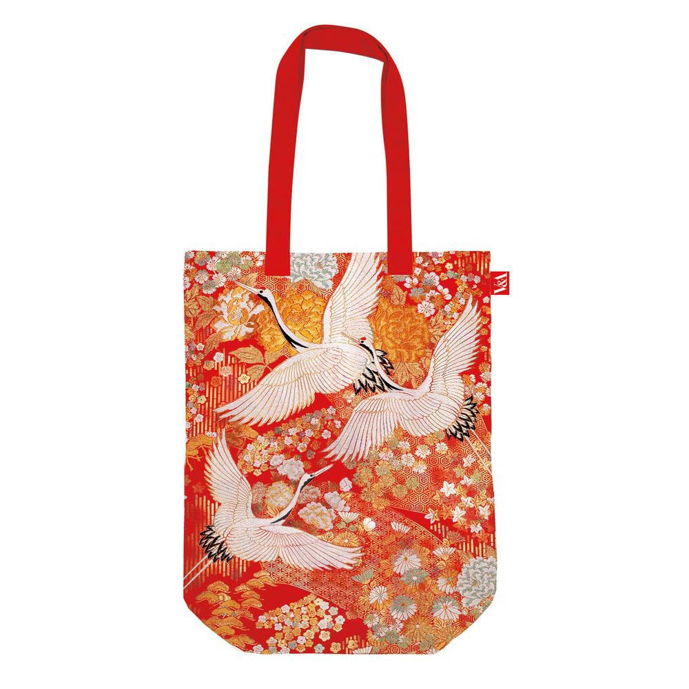 Red and orange tote bag featuring cranes pattern artwork. Red handle. Presented on a white background.