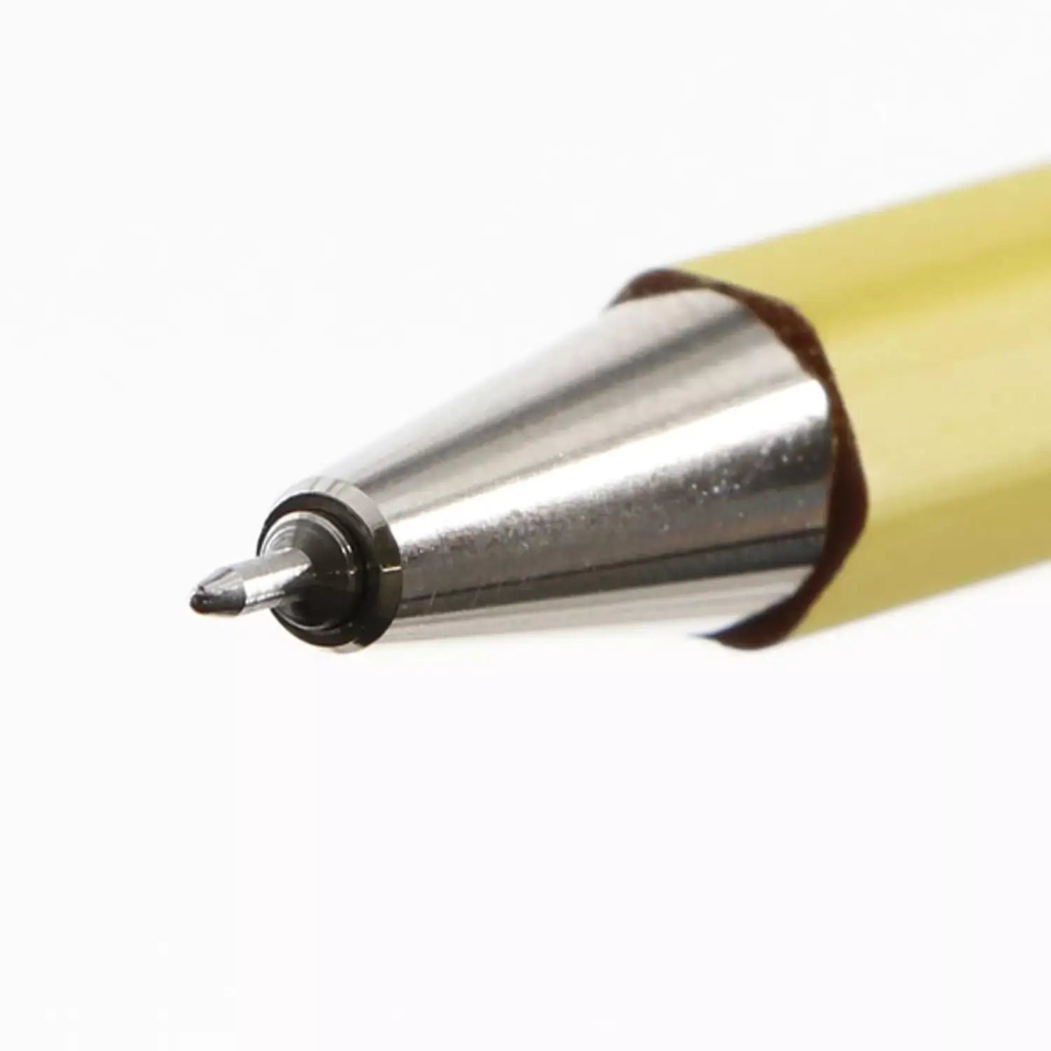 A close-up of the tip of a yellow mechanical pencil. The tip is sharp and has a metal casing.