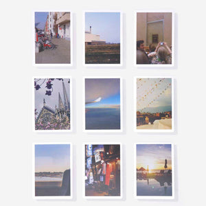A grid of 9 cards each with a different travel photograph.