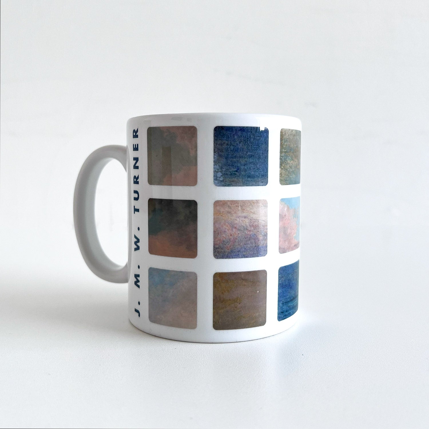 Mug with a grid of details of Turner skies