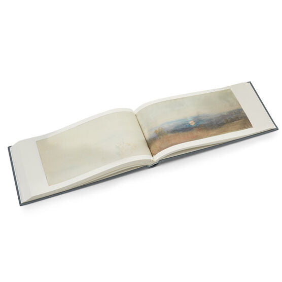 A book open to two pages with a painting of a landscape by William Turner