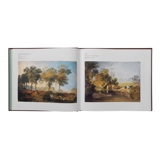 Open book displaying two landscape paintings on a white background