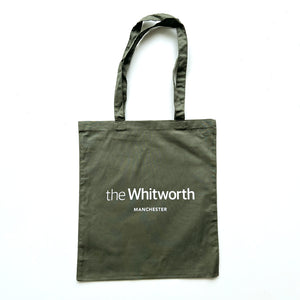 Olive green coloured tote bag with Whitworth logo against white background.
