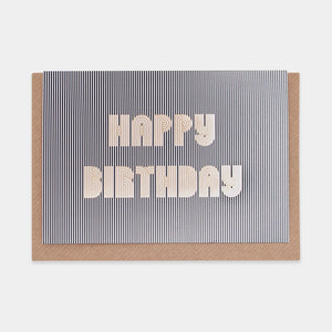 This is a birthday card with black and white stripes and the words "HAPPY BIRTHDAY" written in a cool, bubbly font.
