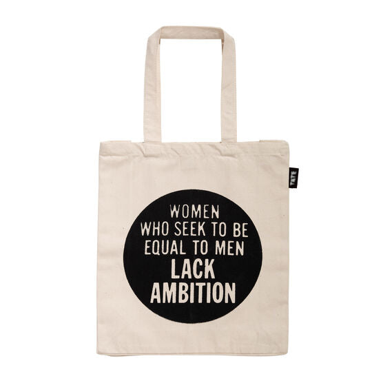 Cream tote bag with a black circle in the middle with the words WOMEN WHO SEEK TO BE EQUAL TO MEN LACK AMBITION.