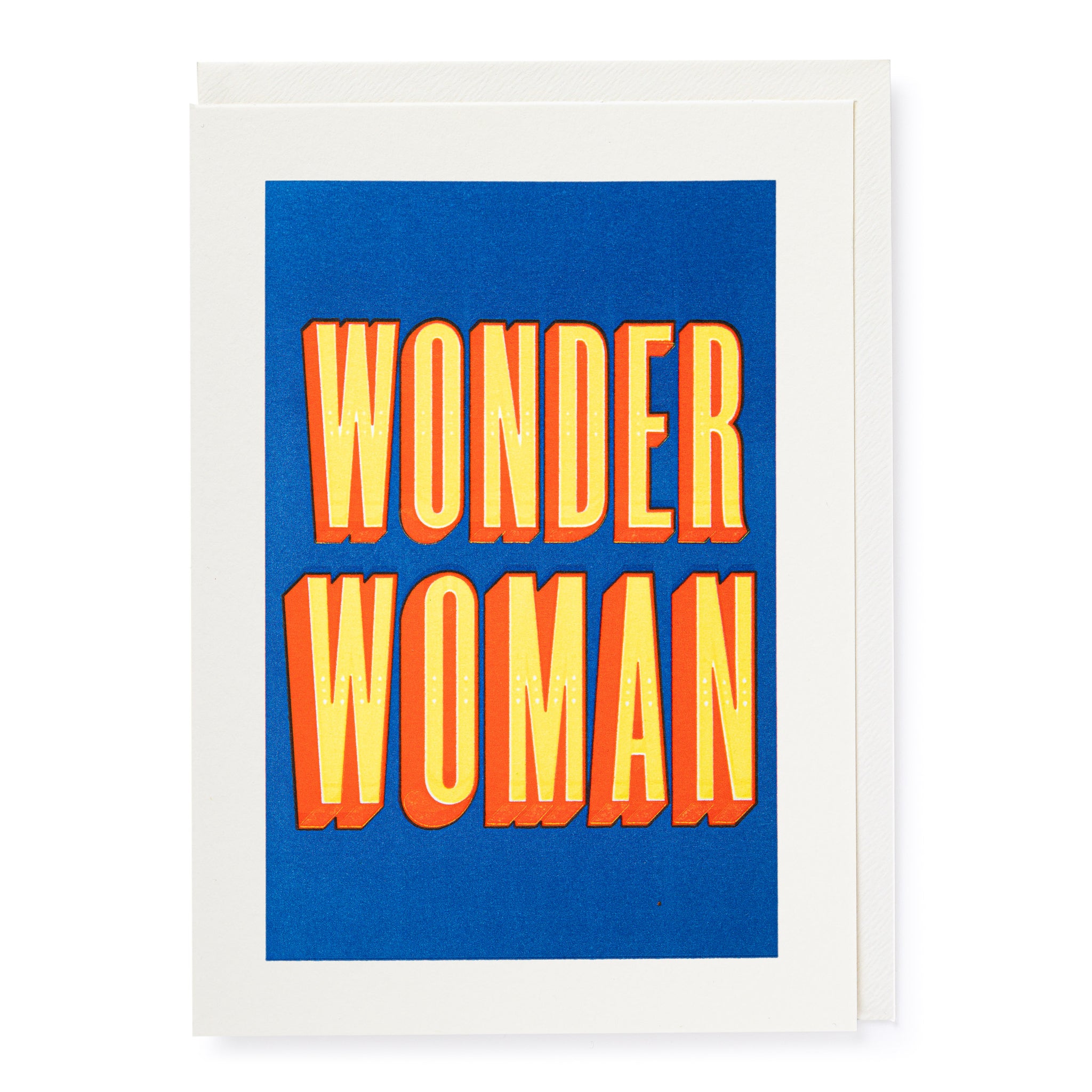 Card with blue background and yellow bold font saying WONDER WOMAN