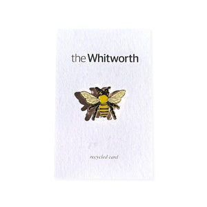 Gold plated worker bee pin badge, presented on recycled card. Whitworth logo.