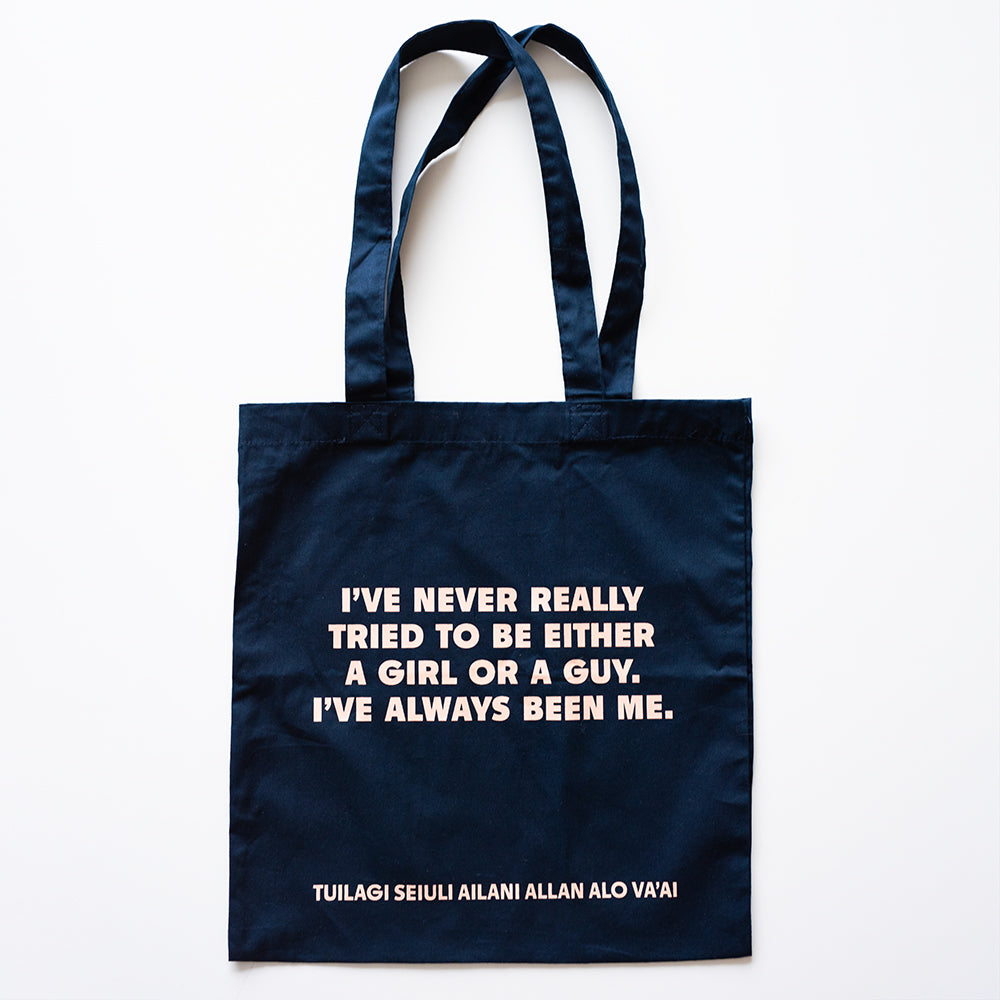 Navy blue tote bag with white text on a white background