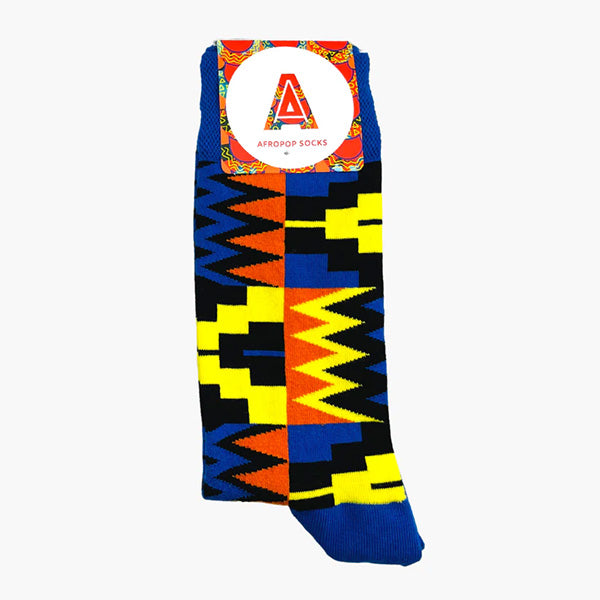 Vibrant blue, yellow and orange socks with geometric pattern photographed against white background.