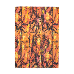 Image of a rectangular notebook, the cover is Althea McNish's textile design Golden Harvest. White backdrop. 
