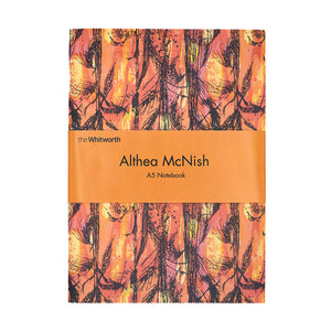 Image of a rectangular notebook, the cover is Althea McNishs textile design Golden Harvest. White backdrop. Notebook has orange belly band with the Whitworth logo and words Althea McNish A5 notebook at the centre.