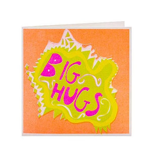 Greetings card, white envelope. Orange front of card with an irregular bright yellwo shape inside of which bright pink text, big hugs.