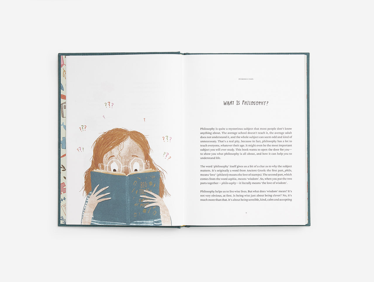 Image of a book opened at the centre. Left page is an illustration of a girl wearing glasses holding a book. The right is text with the title 'What is Philosophy?'