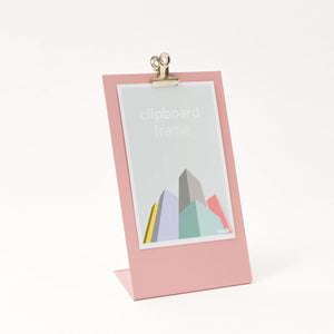 White background shot of the pink clipboard frame with a generic print with white text reading, clipboard frame.