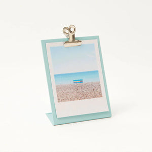 White background shot of the light blue clipboard frame with a generic print.