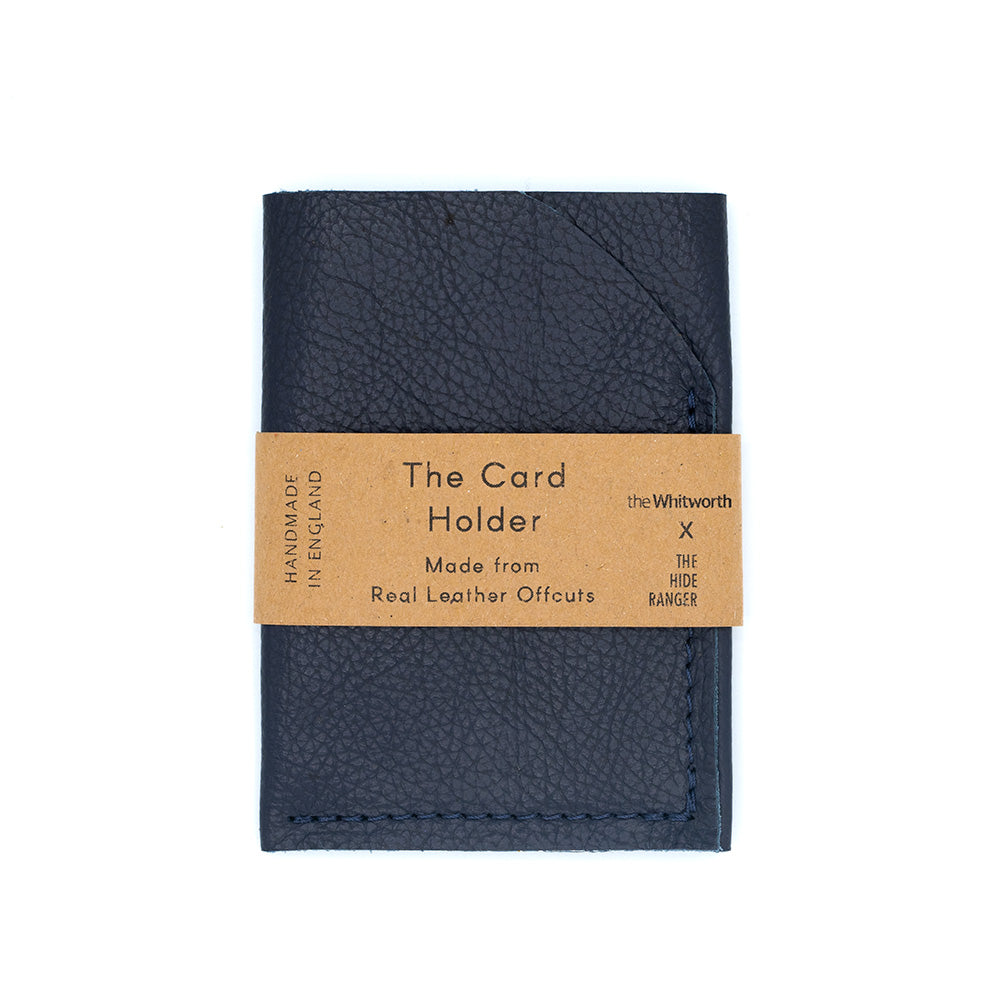 Image of a navy card holder with belly band label against a white background