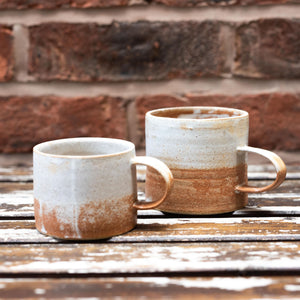 Two clay mugs withnatural glazing