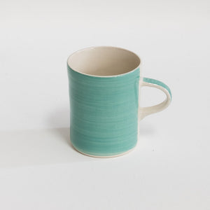 Image of a mint mug against white background