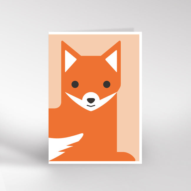 Coral coloured card with a fox lying down and looking in from the lefthand fold.