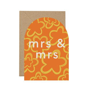 Orange patterned card with brown envelope against white background. The words Mrs and Mrs.
