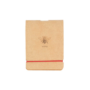 Brown notebook with a bee imprinted at the centre