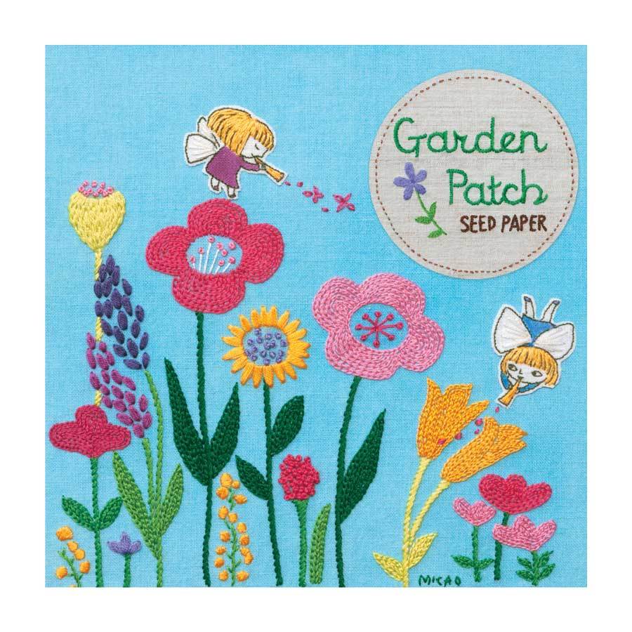Packaging for Garden Patch Seed Paper. An embroidered design of wildflowers with angel figures flying.