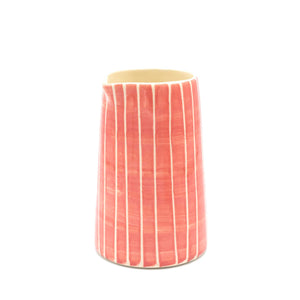 Striped rose creamer jug against white background.
