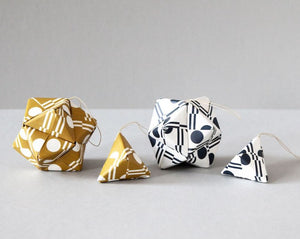 Image of 4 origami shapes in various patterns
