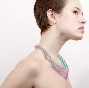 Model wearing pink and green 3D printed necklace