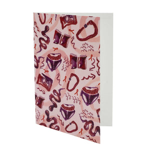 Greetings card featuring a design by Sarah-Joy Ford againt a white background. Pink, red and purple pattern design. White background.