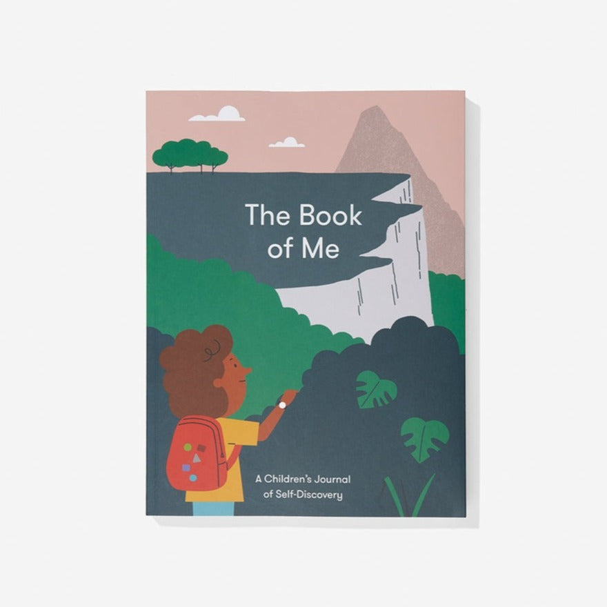 An image of a book with words 'The Book of Me' in the centre of an image of a young girl looking out onto a cliff landscape.